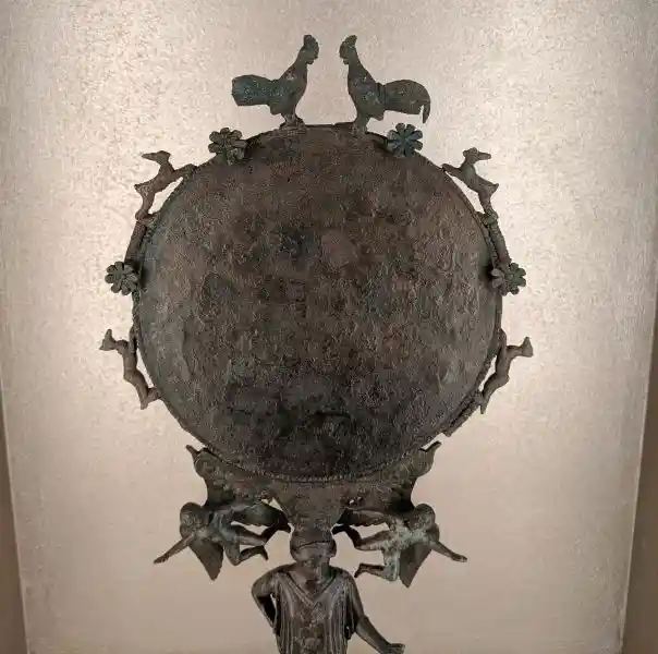 Ancient Greek bronze mirror from an Argive workshop with roosters and animal figures.